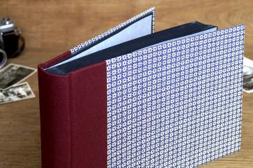 Mini photo album with black cardboard and wine-red linen spine